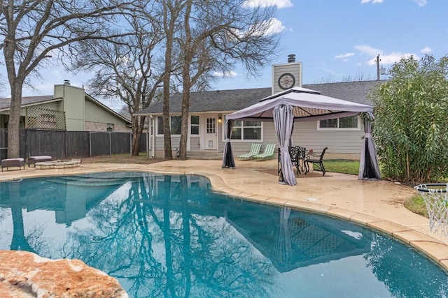 view of swimming pool featuring a gazebo and a patio