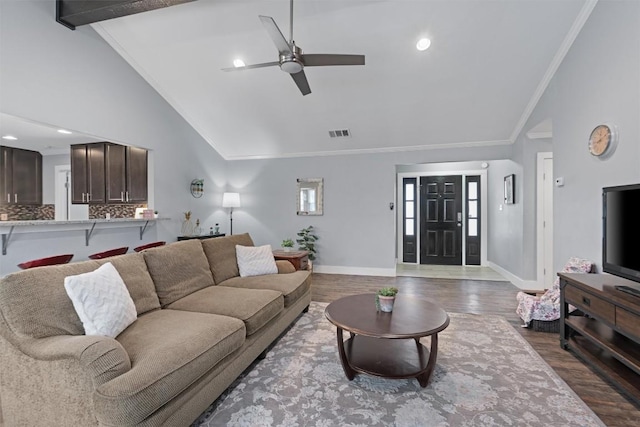 living room with crown molding, ceiling fan, hardwood / wood-style floors, beam ceiling, and high vaulted ceiling