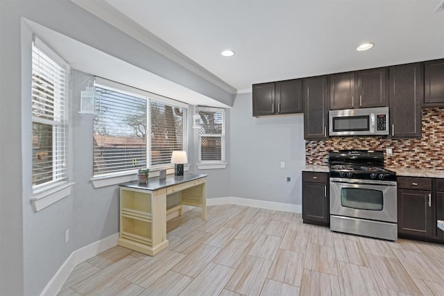 kitchen featuring appliances with stainless steel finishes, dark brown cabinetry, and decorative backsplash