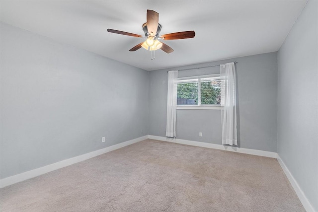 spare room featuring carpet floors and ceiling fan