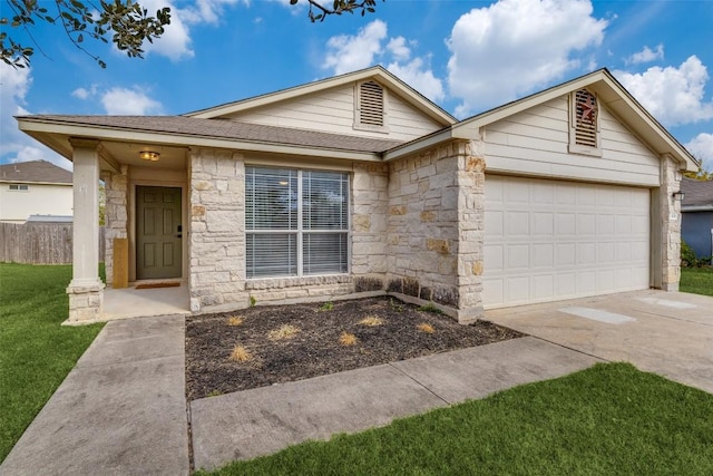 ranch-style home featuring a garage and a front lawn