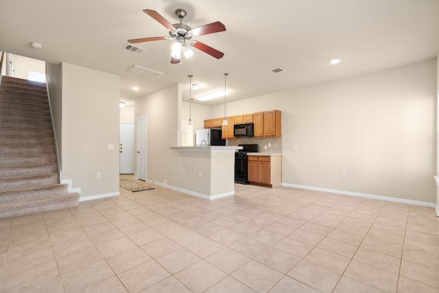 kitchen featuring light tile patterned flooring, tasteful backsplash, hanging light fixtures, ceiling fan, and black appliances