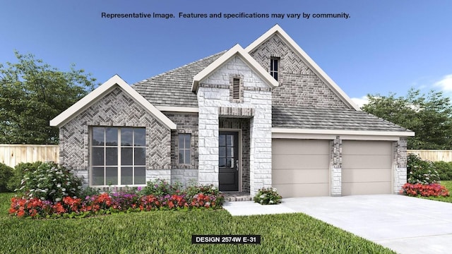 view of front of house with a garage and a front yard