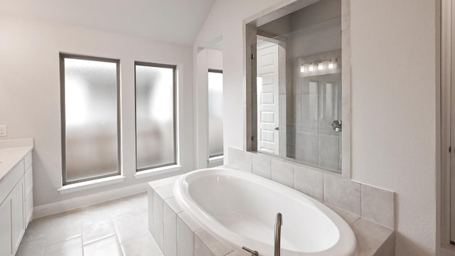 667 Bay Breeze Dr, Kyle, TX 78640 - bathroom with vanity, a bath, and tile patterned flooring