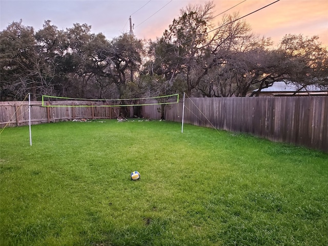 yard at dusk with volleyball court