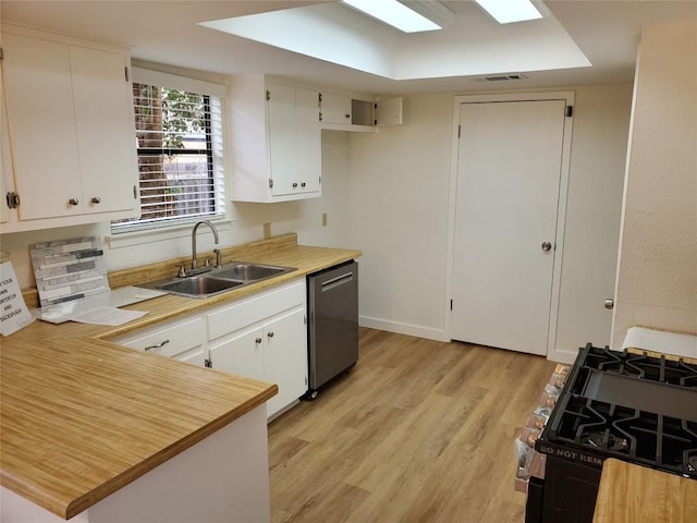 kitchen with sink, range with gas cooktop, white cabinetry, stainless steel dishwasher, and light hardwood / wood-style floors