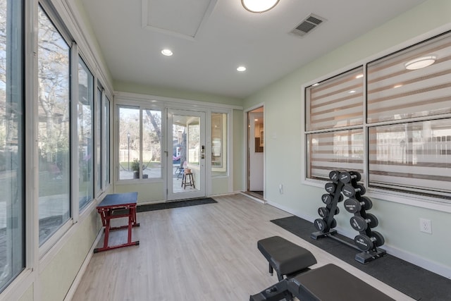 workout area featuring light wood-type flooring