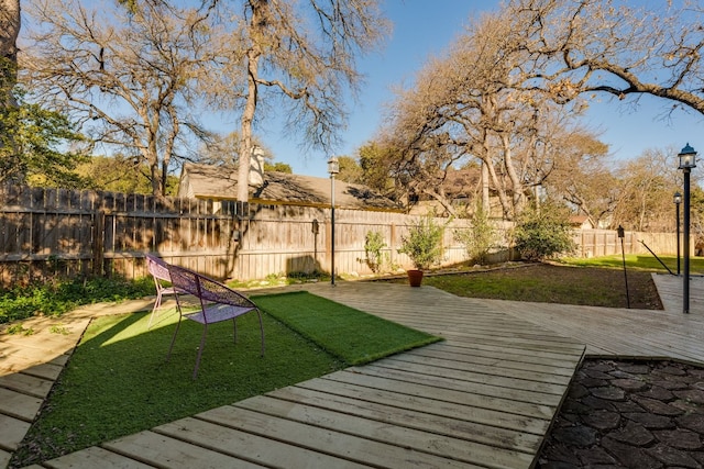 view of yard featuring a wooden deck