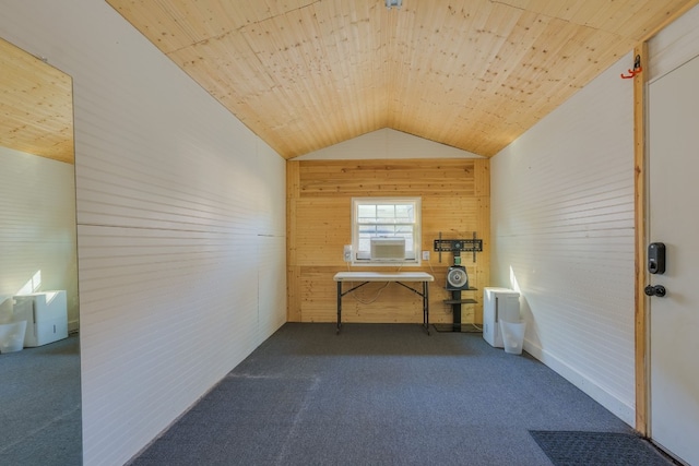 interior space featuring vaulted ceiling, carpet flooring, wooden ceiling, and wooden walls