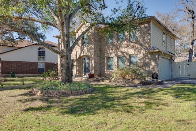 view of front of property with a garage and a front yard