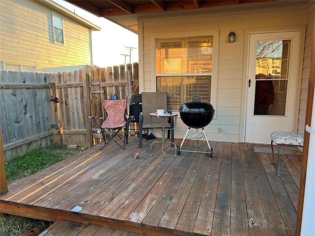 wooden terrace with a grill