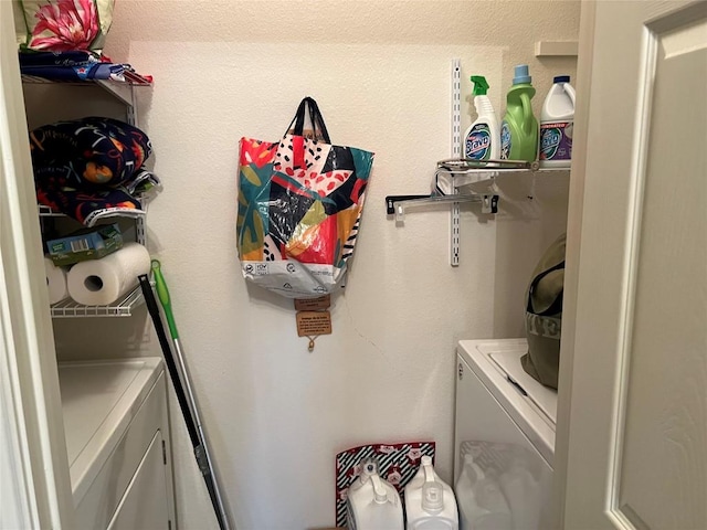 laundry room with washing machine and clothes dryer