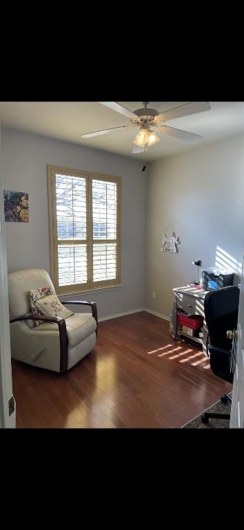 office space with dark wood-type flooring and ceiling fan