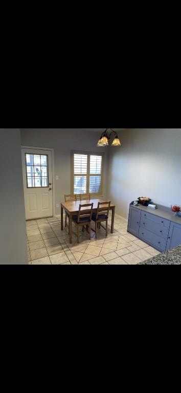 dining area with light tile patterned floors