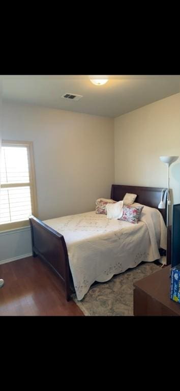 bedroom featuring dark wood-type flooring