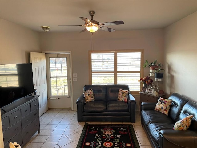 tiled living room with ceiling fan