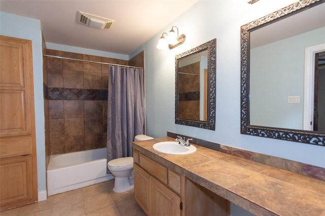 full bathroom with shower / tub combo, vanity, tile patterned floors, and toilet