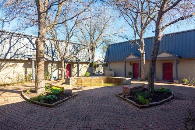 view of community with a garage