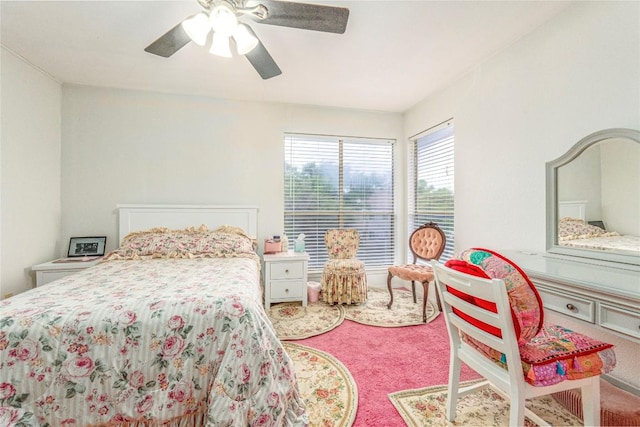 bedroom with ceiling fan and carpet flooring