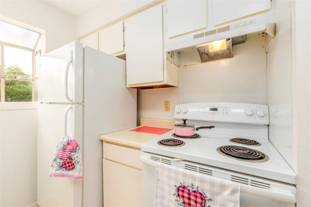 kitchen with white cabinetry and white appliances