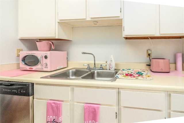 kitchen featuring white cabinetry, sink, and stainless steel dishwasher