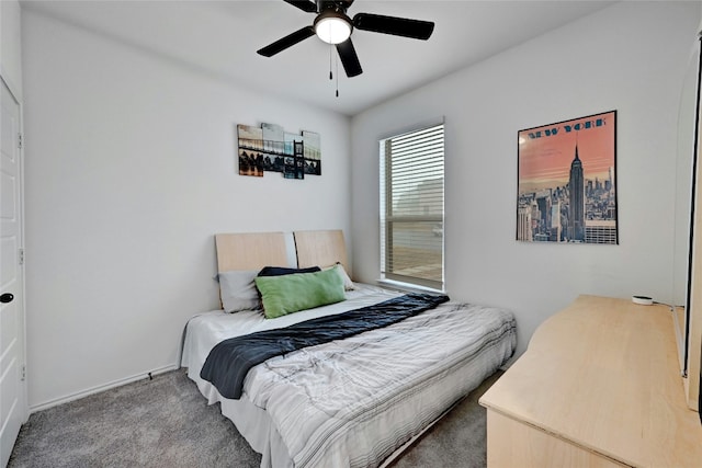 bedroom with ceiling fan and carpet flooring