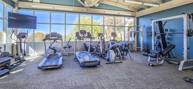 gym with wood ceiling, vaulted ceiling, and carpet