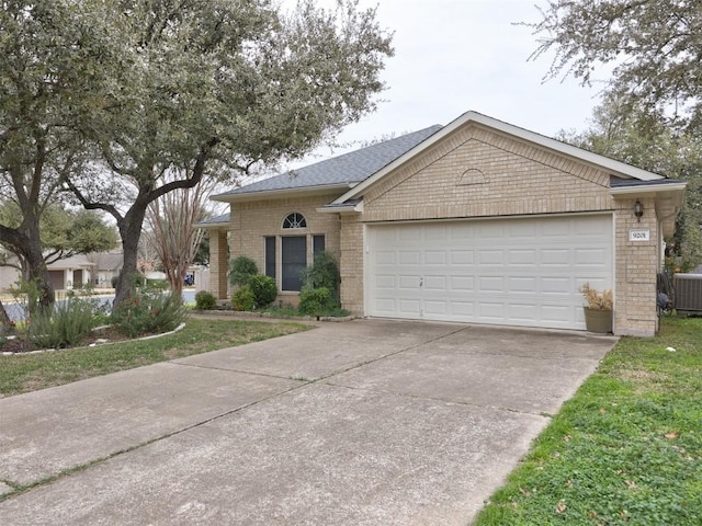 single story home featuring a garage