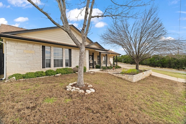 view of property exterior featuring a lawn