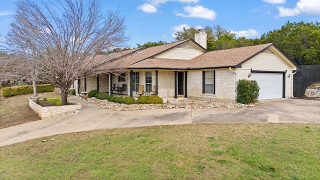 ranch-style home featuring a garage and a front yard