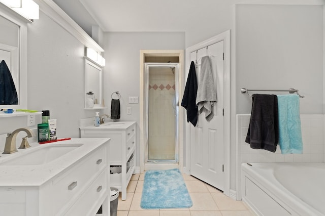 bathroom with tile patterned flooring, vanity, and independent shower and bath