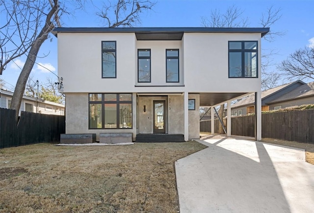 view of front of house with a front yard and covered porch