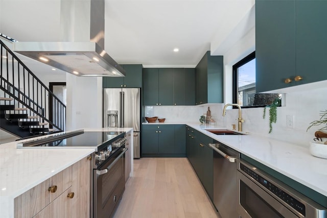 kitchen featuring sink, backsplash, high quality appliances, light stone countertops, and island exhaust hood