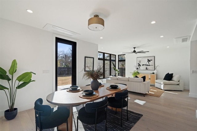 dining room with light hardwood / wood-style flooring