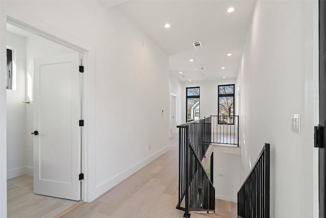 hall with light hardwood / wood-style floors