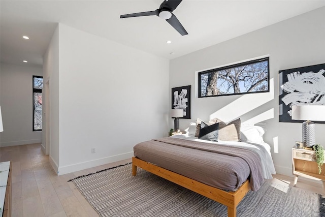 bedroom featuring ceiling fan and light hardwood / wood-style floors