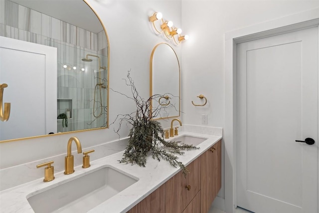 bathroom featuring vanity and tiled shower