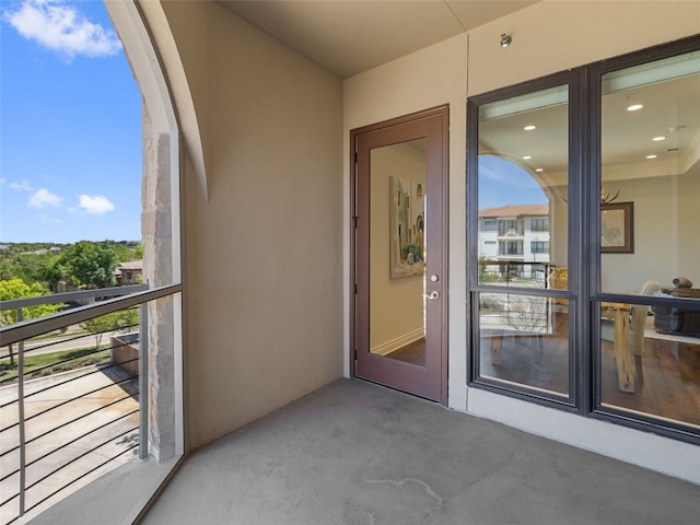 property entrance with a balcony