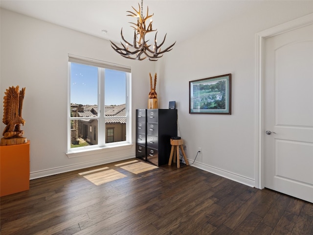 interior space featuring dark hardwood / wood-style floors and a chandelier