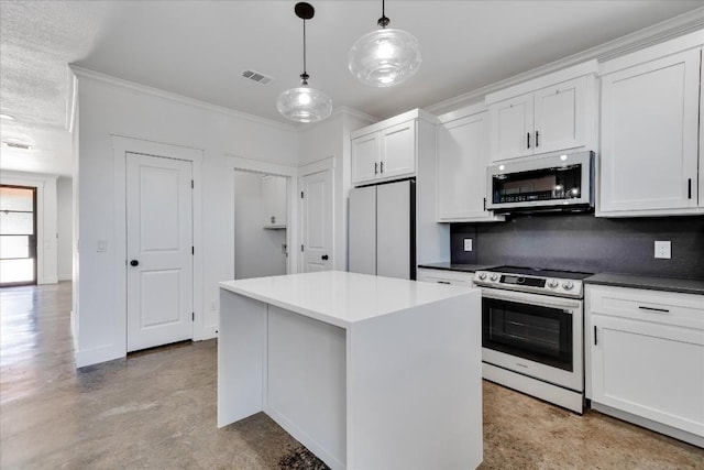 kitchen featuring decorative light fixtures, a center island, white cabinets, stainless steel appliances, and backsplash