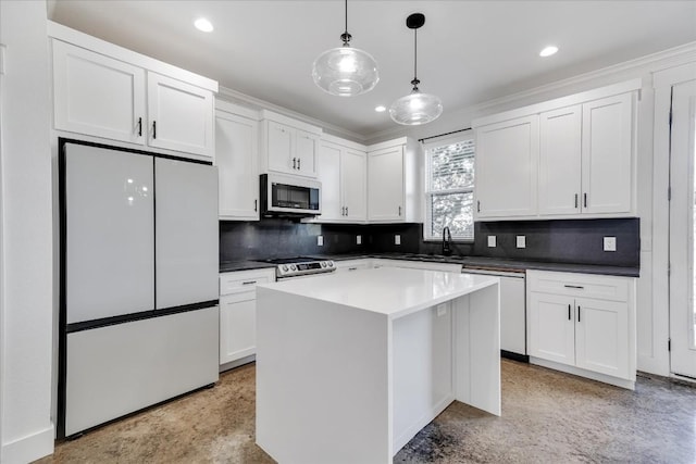 kitchen featuring white cabinetry, hanging light fixtures, white appliances, and a center island