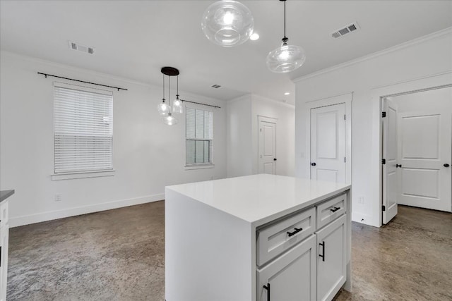 kitchen with crown molding, hanging light fixtures, a kitchen island, and white cabinets