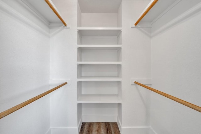 walk in closet featuring hardwood / wood-style floors