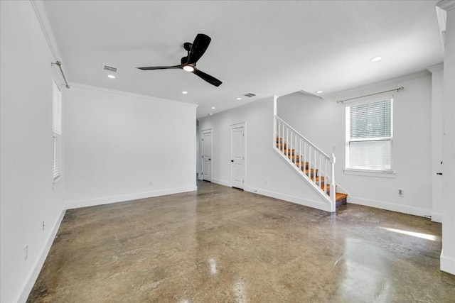 unfurnished living room featuring crown molding, ceiling fan, and concrete flooring