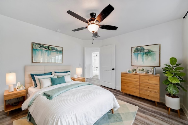 bedroom with wood-type flooring and ceiling fan