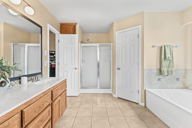 bathroom with vanity, tile patterned floors, and separate shower and tub