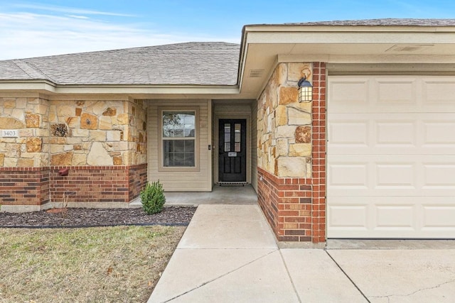 doorway to property featuring a garage