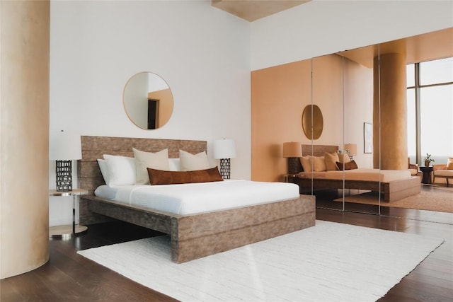 bedroom featuring dark hardwood / wood-style flooring