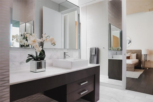 bathroom with vanity and backsplash