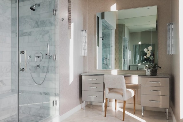 bathroom featuring walk in shower and vanity